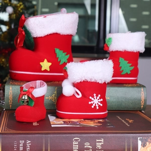 Detail of red flocked Christmas boots with white faux fur on vintage books