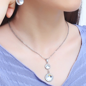 Elegant titanium steel jewelry set with circular crystal necklace and matching earrings