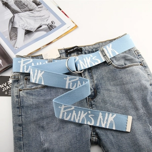 Close-up of light blue canvas belt with white graffiti print and double D-ring buckle