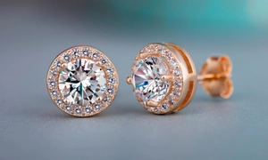 Elegant rose gold halo stud earrings featuring a brilliant round-cut central gemstone