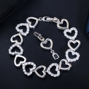 Exquisite silver hollow heart bracelet with cubic zirconia paving on black background