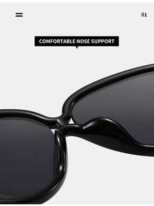 Détail de lunettes de soleil oversize montrant les plaquettes de nez intégrées