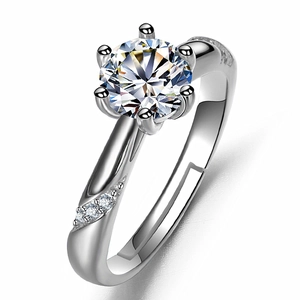 Detailed view of a six-prong silver ring with a large brilliant round solitaire stone