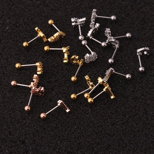 Mix of stainless steel cartilage studs with moon, star, and elephant motifs in three finishes