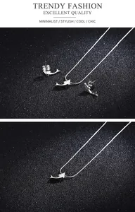 Detailed view of fine steel dolphin jewelry set featuring a polished silver necklace and studs