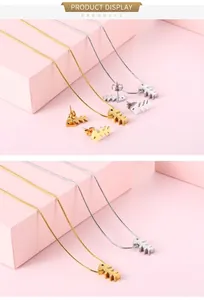 Detailansicht von Gold- und Silber-Fischgräten-Schmuckset mit passenden Ohrringen
