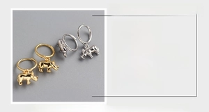 Detail showing S925 sterling silver rhino hoop earrings in gold and silver finishes