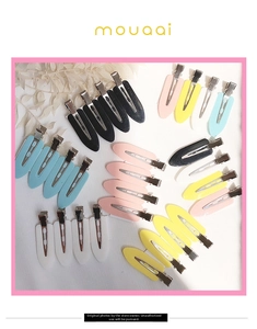 Macro detail of seamless duckbill hair clips in pastel macaron colors for hairstyling