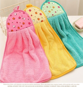 Three-pack hanging coral fleece towels in pink, yellow and green for kitchen use