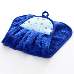Detail of blue coral velvet hand towel with hanging loop and colorful apple embroidery