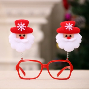 Detail of red Christmas glasses with a spring-mounted Santa Claus doll for festive parties