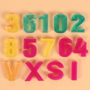 Flat lay of colorful translucent resin numbers and letters for DIY craft projects