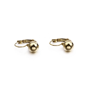 Fashionable gold ball clip-on earrings with a polished metallic finish on a white background