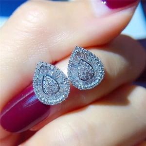 Elegant silver teardrop earrings with sparkling white cubic zirconia and halo cluster design