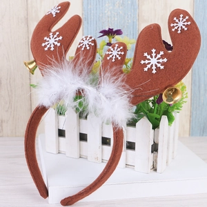 Christmas reindeer antler headband with white feathers and gold bells for festive party