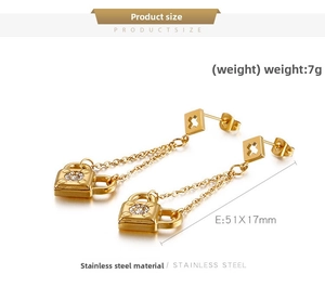 Detailed view of gold stainless steel padlock earrings with chain and zircon insets