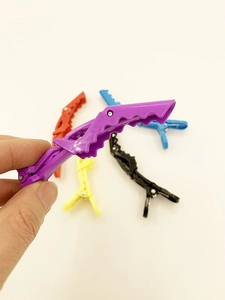 Macro detail of colorful professional sectioning hair clips for styling and salon use