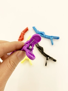 Macro shot of colorful plastic sectioning crocodile clips with durable metal springs