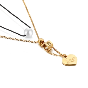Gold layered necklace with pearl, letter B cylinder and engraved Love heart pendant