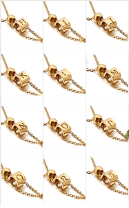 Detailed grid of gold hollow cylinder alphabet pendants from H to S on fine chains