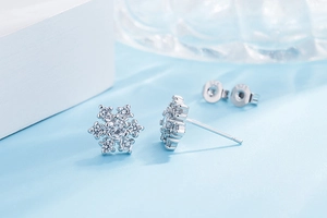 Macro shot of S925 sterling silver snowflake earrings with cubic zirconia stones