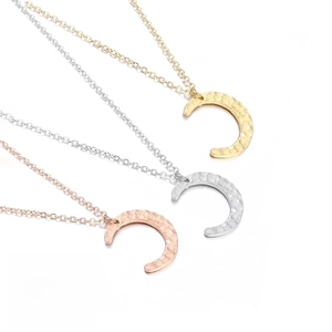 Detailed comparison of three stainless steel moon necklaces in gold, silver, and rose gold