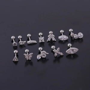 Set of 12 stainless steel stud earrings with butterfly, snake, and evil eye designs