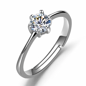 Detail of a six-prong silver ring featuring a round brilliant zircon and adjustable band