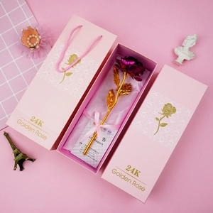 Detail view of purple 24K gold foil rose with pink gift box and golden rose text