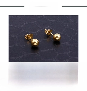 Macro shot of 18k gold plated stainless steel ball stud earrings with product specs