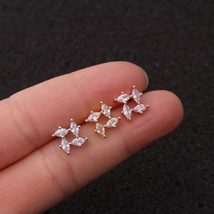 Three-color clover ear studs in silver, gold, and rose gold with clear cubic zirconia