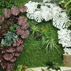 Faux monstera leaves and assorted greenery wall panel for elegant home and event decor