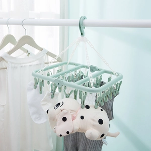 Mint green folding laundry rack with 32 clips for drying socks and baby clothes