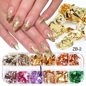 Detailed view of 12-grid nail art foil set with metallic gold and silver flakes