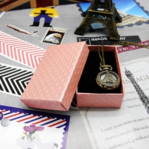 Vintage bronze Eiffel Tower pocket watch necklace in a pink diamond pattern gift box