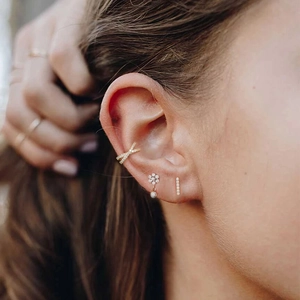 S925 sterling silver gold plated stud earrings set with micro pave zircon on female model