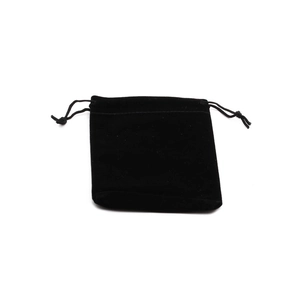 Close-up of a black velvet drawstring pouch with soft texture and knotted cords