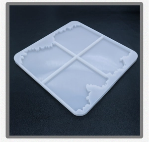 Detail of four-grid silicone mold with wavy edges for DIY resin coaster making