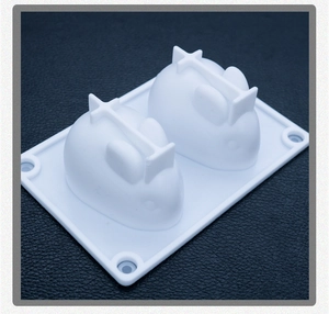Detail of white silicone bunny mold with two cavities for jelly and rice cake making
