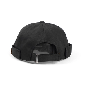Close-up of black cotton docker cap with adjustable metal buckle on white background