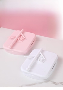 Detail of foldable desktop makeup mirror with detachable base shown in pink and white