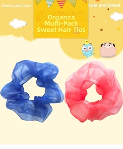 Macro detail of royal blue and rose pink organza scrunchies with pleated texture