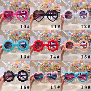 Collage of colorful heart and flower shaped sunglasses for kids in various bright styles