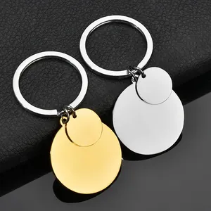 Polished stainless steel keychains in gold and silver showing macro details and mirror finish