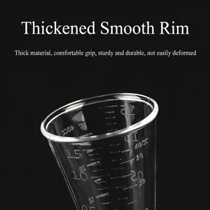 Professional PC resin double jigger with dual OZ and CC measurement scales on black background