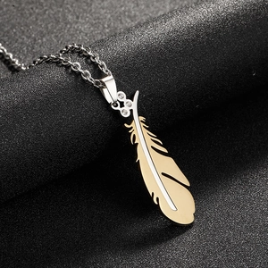 Fashionable gold angel feather pendant on a silver steel chain for couples