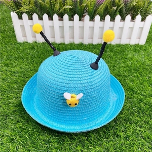 Blue bee-themed woven straw sun hat for children featuring cute plush yellow antennae