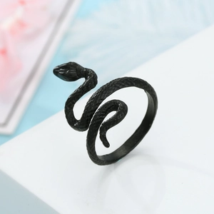 Macro shot of black adjustable snake wrap ring with detailed scales and punk style