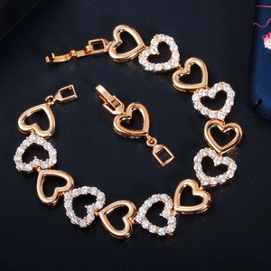 Detailed view of hollow heart bracelet with pavé white zircon in gold-tone finish