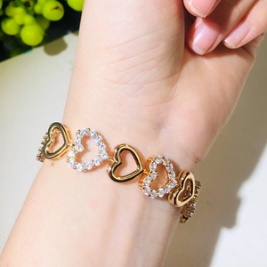 Detail of gold-plated hollow heart bracelet with micro-pasted white zircon stones